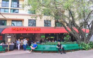 street level exterior of restaurant with red awning at park tavern delray beach