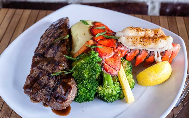 surf n turf entree on square plate at bostons on the beach delray beach