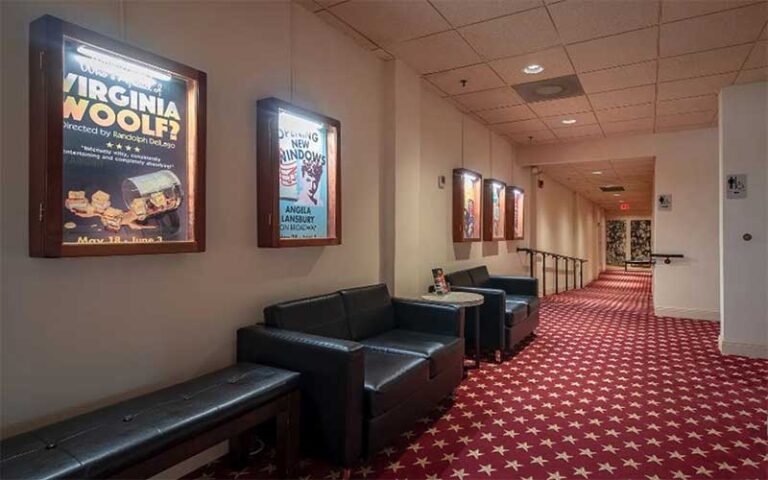 theater lobby with leather seating and posters at delray beach playhouse