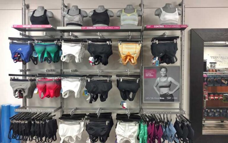 womens sports bras and tops on retail rack at fleet feet delray beach