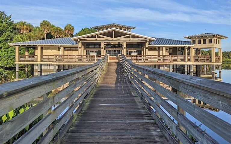 wooden pavilion with boardwalks over lake at green cay nature center wetlands boynton beach