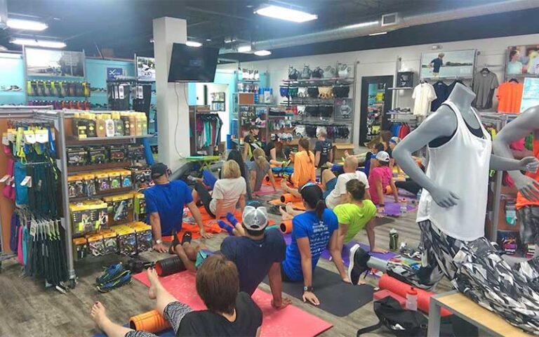 yoga class in store interior at fleet feet delray beach