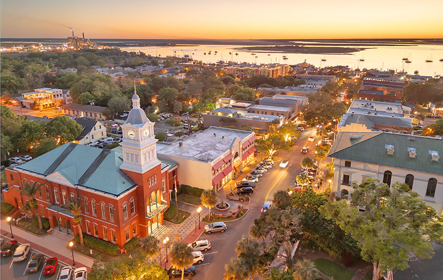 aerial of downtown fernandina beach with church and marina under sunset sky amelia island