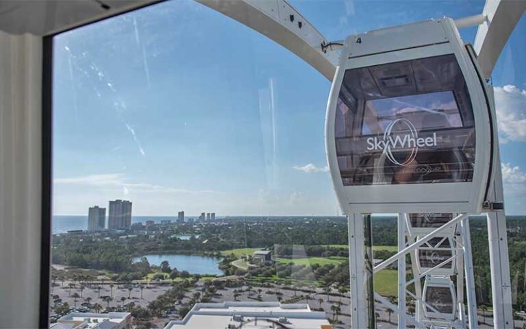 aerial view from gondola of beach and other gondolas at skywheel at pier park panama city beach