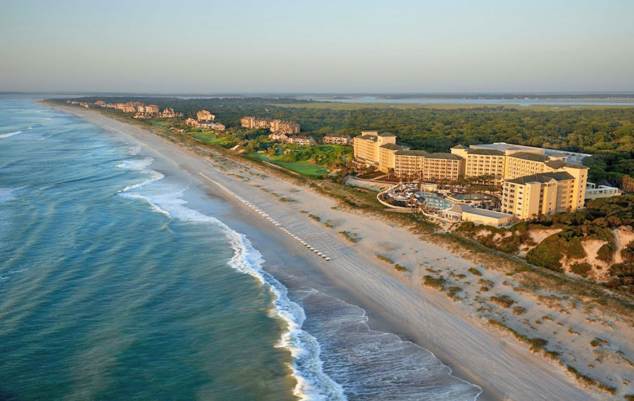 aerial view of coastline along beach with hotel buildings at omni amelia island resort