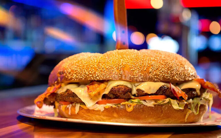 behemoth burger on plate with knife at bowlero west ocala