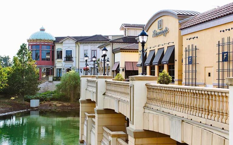 bridge view of restaurant with water feature below at dellagio town center orlando