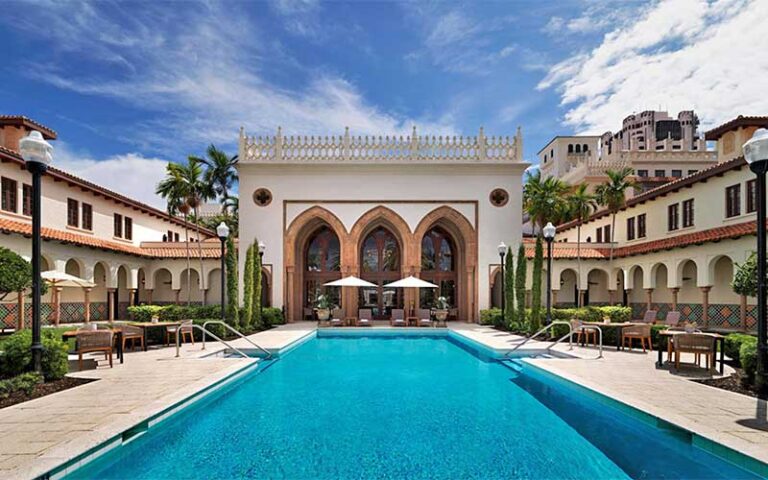 courtyard pool with mediterranean accents at beach club at the boca raton