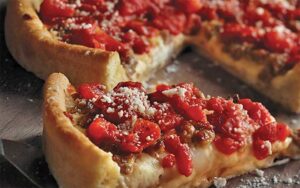 deep dish pizza with slice at uno pizzeria grill orlando kissimmee