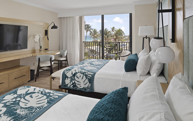 double queen room with ocean decor and view at opal grand resort spa delray beach