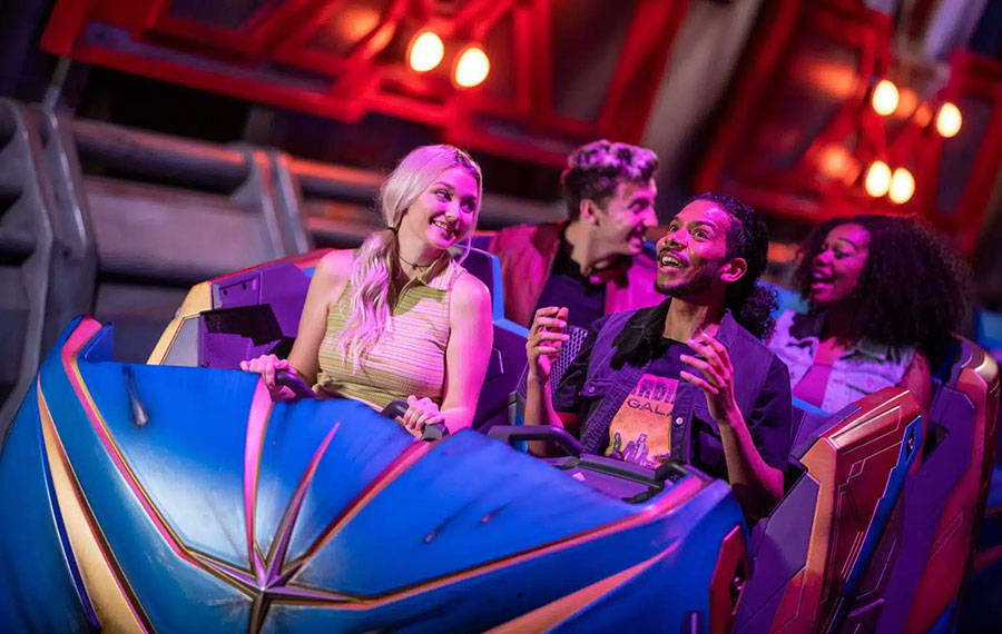 excited riders on indoor roller coaster at guardians of the galaxy cosmic rewind epcot disney world