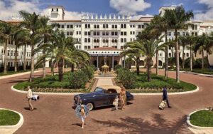 front courtyard of stately hotel with palms and rolls royce at beach club at the boca raton