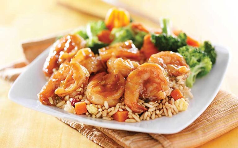 glazed shrimp plated with rice and stir fried vegetables at okayama sushi hibachi orlando