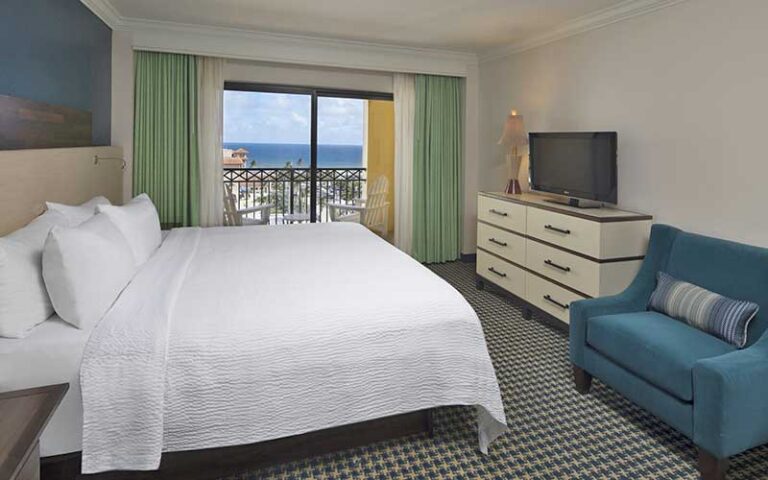 king bed suite with balcony and ocean view at the atlantic suites on the ave delray beach