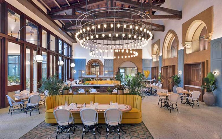 lobby area with vaulted timber ceiling and chandeliers at beach club at the boca raton