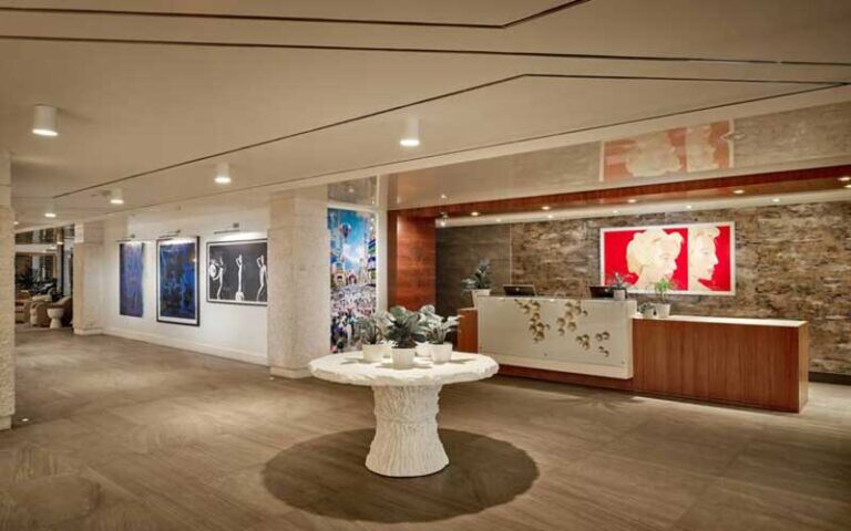 lobby with front desk and chic decor at waterstone resort marina boca raton