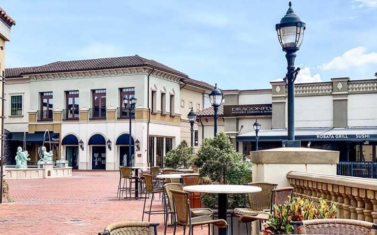 shopping plaza with fountain and patio seating at dellagio town center orlando