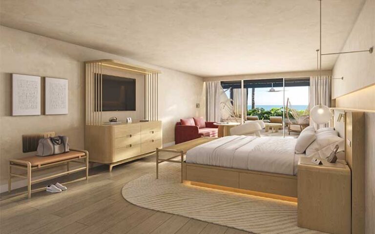 spacious hotel suite with king bed and ocean view at beach club at the boca raton