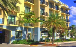 yellow high rise hotel with balconies at vistalmar beach resort deerfield beach