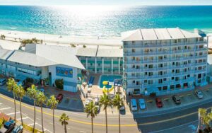 aerial view of beachfront hotel along road at the sandpiper beacon beach resort panama city beach