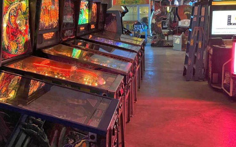 arcade with games and red lighting at bragging rights amusements gainesville