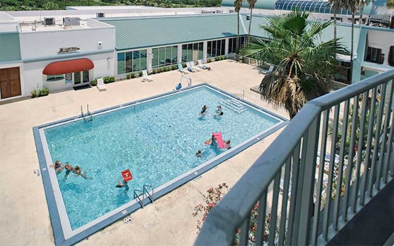 balcony view of pool area with swimmers at boardwalk beach hotel convention center panama city beach