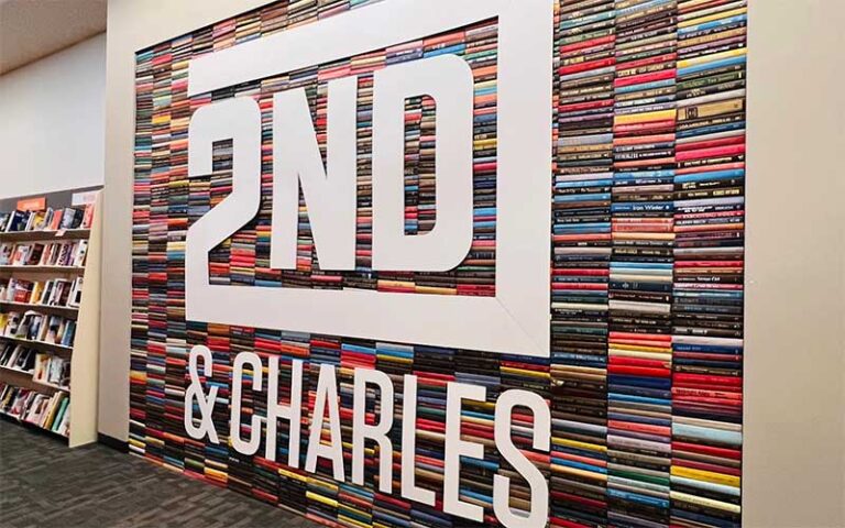 book store wall mural with logo and stacks of book spines at 2nd charles gainesville