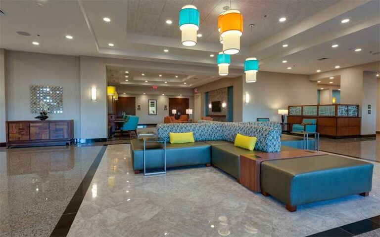 colorful modern styled lobby and front desk at drury inn suites gainesville