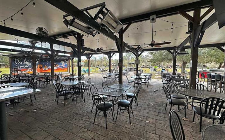 covered outdoor patio with stage and mural at one love cafe gainesville