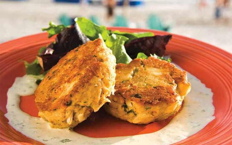 crab cakes on red plate at schooners panama city beach