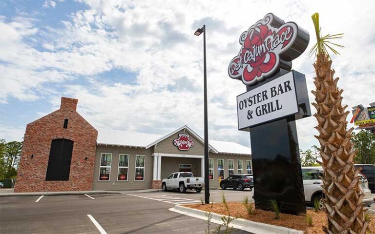 daytime exterior of restaurant and sign at dat cajun place cafe panama city beach