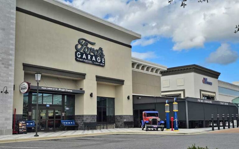 daytime exterior of restaurant with model t and gas pumps at fords garage gainesville