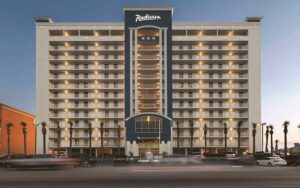 daytime exterior street view of high rise at radisson hotel panama city beach oceanfront