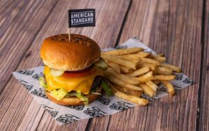 deluxe burger with fries and american standard flag at fords garage gainesville