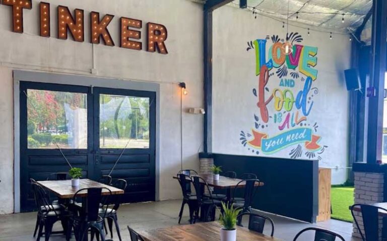 dining room interior with wall mural at tinker latin restaurant gainesville