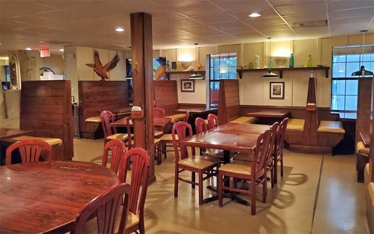 dining room with wood booths and tables at northwest grille gainesville