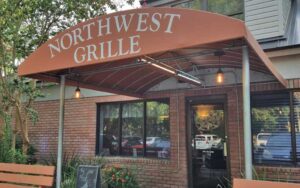 exterior of restaurant with awning and entrance at northwest grille gainesville