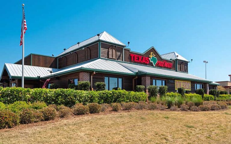 exterior of restaurant with log cabin design at pier park north panama city beach