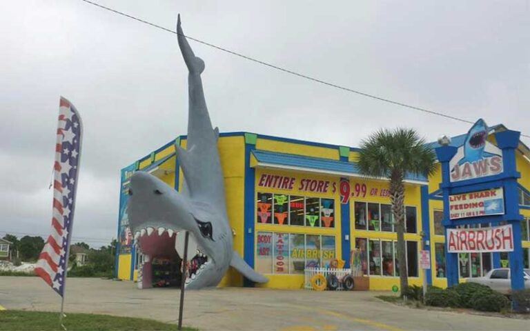 exterior of roadside store with giant shark doorway at jaws souvenirs panama city beach