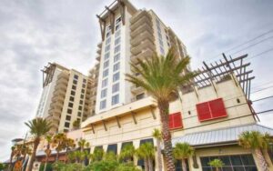 exterior view of condo high rise from street level at origin at seahaven panama city beach