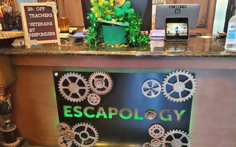 front desk with signs at escapology gainesville