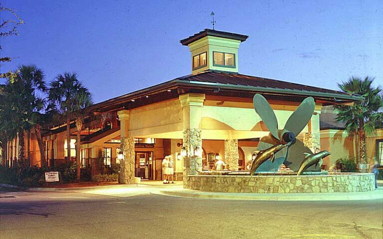 front exterior at night of building with boat prop at capt andersons restaurant waterfront market panama city beach