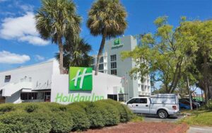 front exterior of hotel with sign and parking at holiday inn gainesville university center