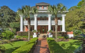 front exterior of mansion inn with four column porch at herlong mansion micanopy gainesville