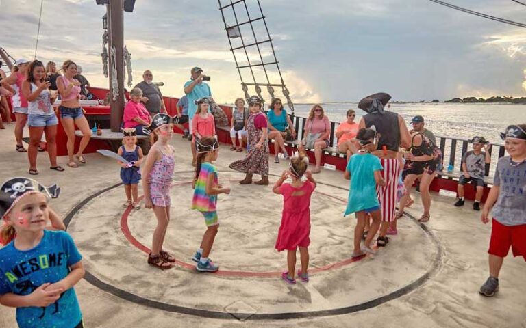 group of costumed kids playing game on ship deck at sea dragon pirate cruise panama city beach