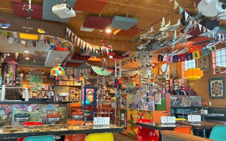 interior dining area with eclectic art at satchels pizza gainesville