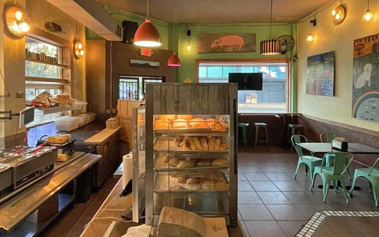 interior of bakery with counter and seating at flacos gainesville