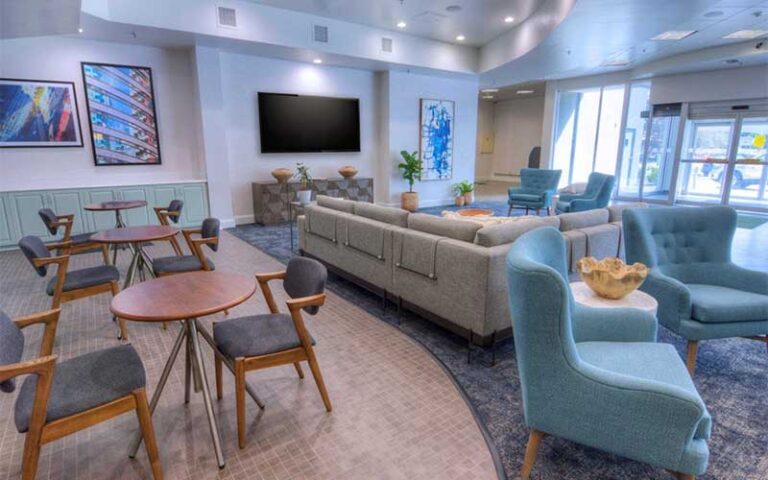 lobby area with tables and lounge seating at holiday inn gainesville university center