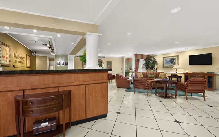 lobby with front desk at baymont by wyndham gainesville