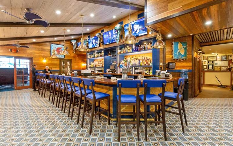 long bar with blue seats in dining area at capt andersons restaurant waterfront market panama city beach